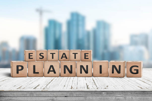 Wooden letter blocks spelling “Estate Planning” with a city skyline in the background.